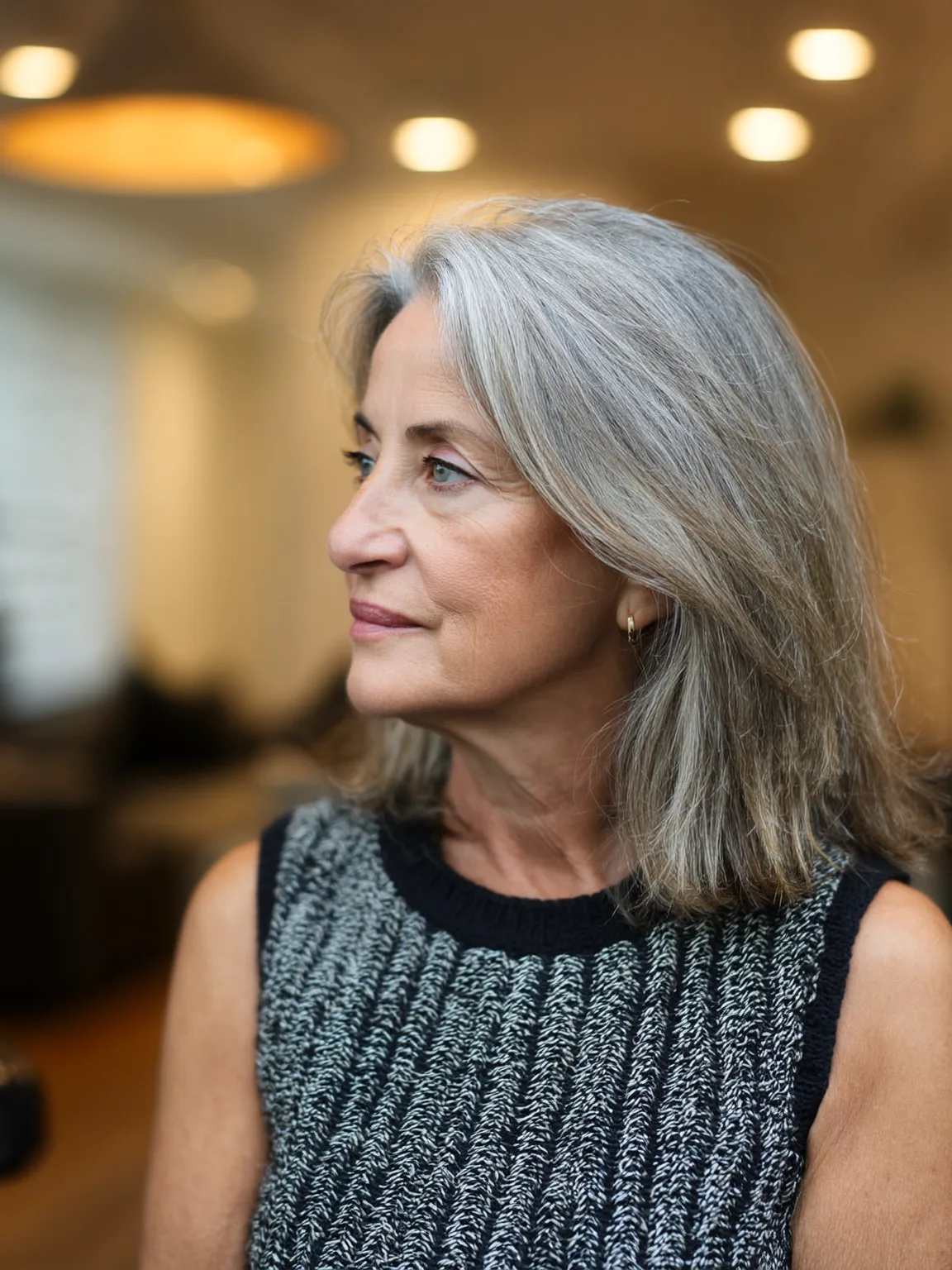 Silver Grey Shoulder-Length Layers with Side-Swept Bangs